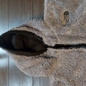 Reversible North Face jacket. It's gray on the inside and black and red.